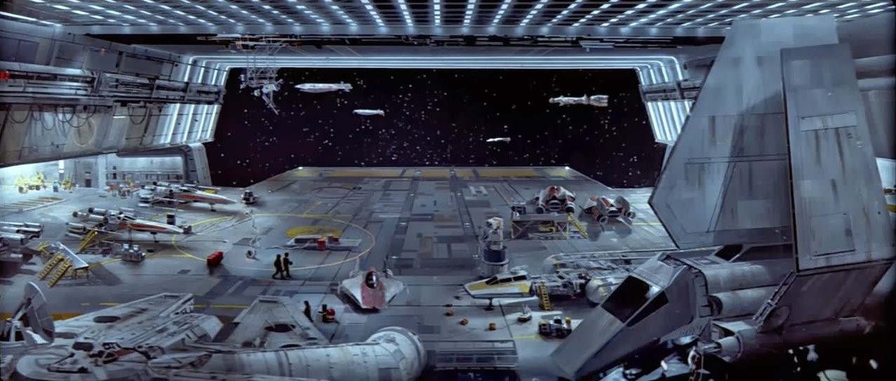 A photo of the hangar on a Calamari cruiser with Rebel fighter ships and a shuttle.